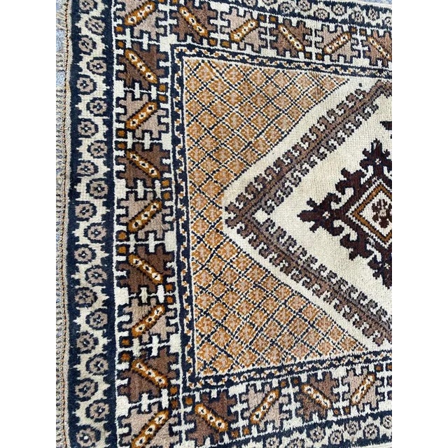 Nice mid century tribal Moroccan rug with beautiful geometric design and light colors with beige and brown, entirely hand...