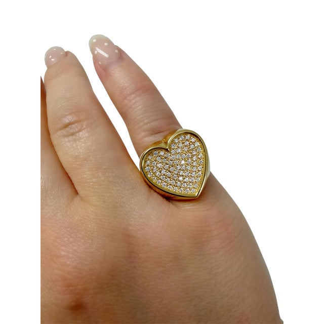 This fun heart ring contains 73 round brilliant cut diamonds weighing approximately 0.50 carat total. Mounted in 18 karat...