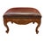 Vintage Louis XV-style footstool featuring an ornately carved wood frame, cabriole legs, floral and foliate decoration,...