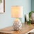 This stunning artichoke-inspired ceramic lamp is hand finished with antiqued edges. Topped with a natural linen shade, it...