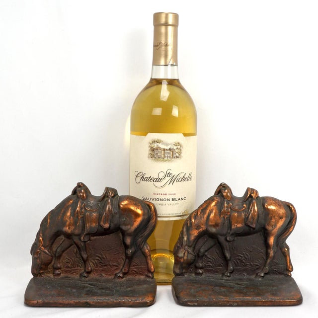 These evocative cast iron bookends capture a moment of quiet reflection, featuring horses with lowered heads and empty...