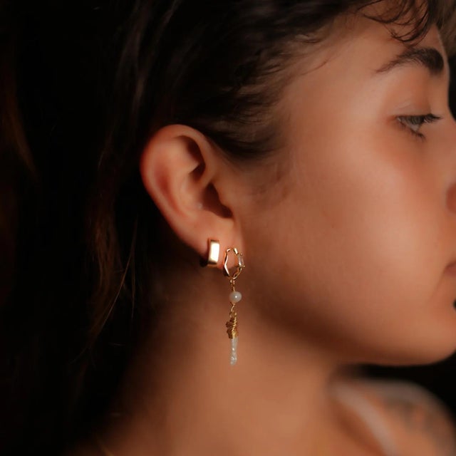 Gold & Diamond Stud Pearl Drop Statement Earrings, featuring 24k gold plated studs adorned with a sparkling baguette...