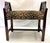 Classic vintage vanity stool from the mid 20th century. It is made of solid wood with curved arms perfect for tucking...