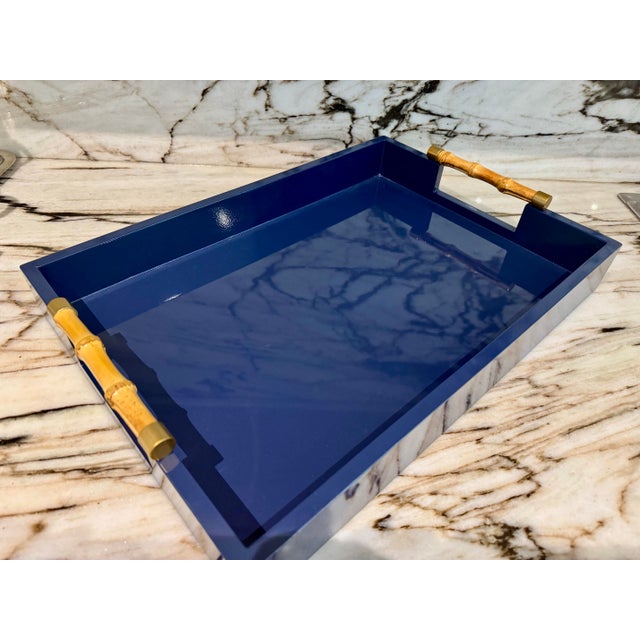 Gorgeous lacquered navy blue finish and bamboo handles detail tray. This versatile and beautiful tray can be used as...