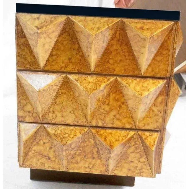 Modern gilt lacquered studded chest of drawers, with black lacquered top fitted with two drawers, one smaller and the...