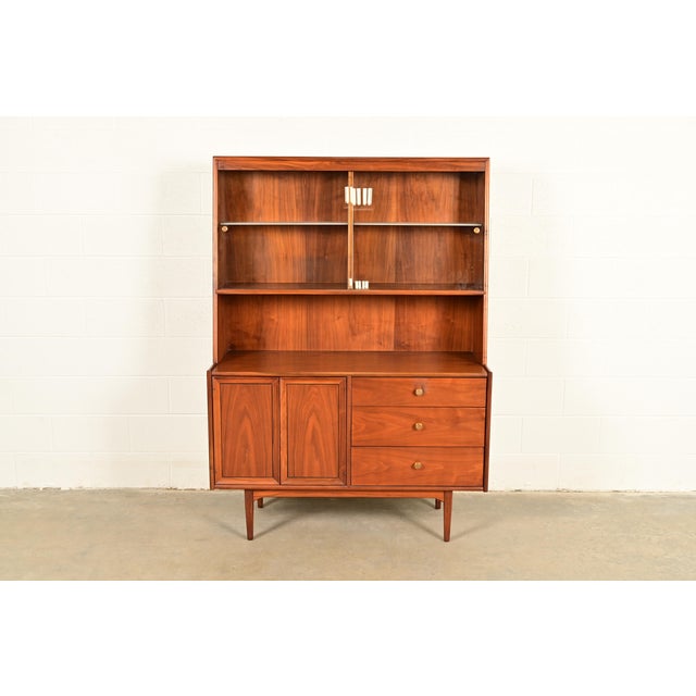An exceptional Mid-Century Modern lighted breakfront, bar cabinet, or sideboard hutch By Kipp Stewart for Drexel,...