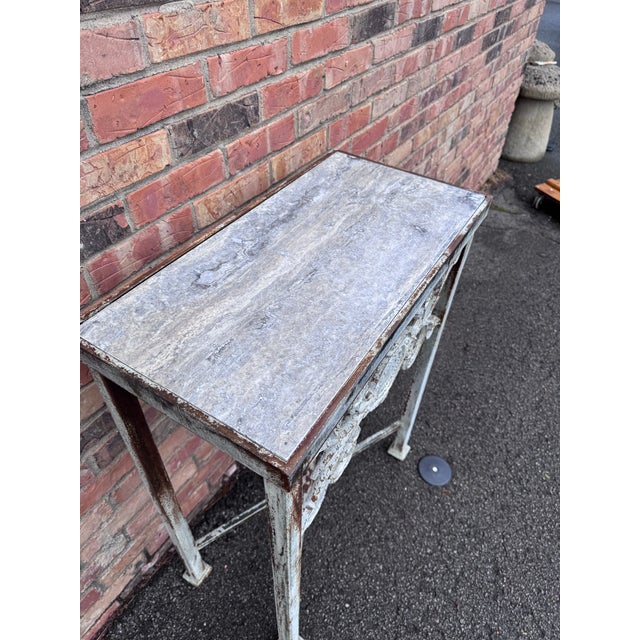 This is a lovely Locally made iron console table with a beautiful aged zinc finish, it also features a marble top for...
