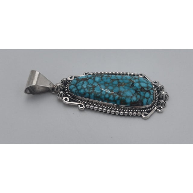 Authentic Native American Handmade Jewelry This beautiful elongated domed teardrop pendant features genuine Kingman...