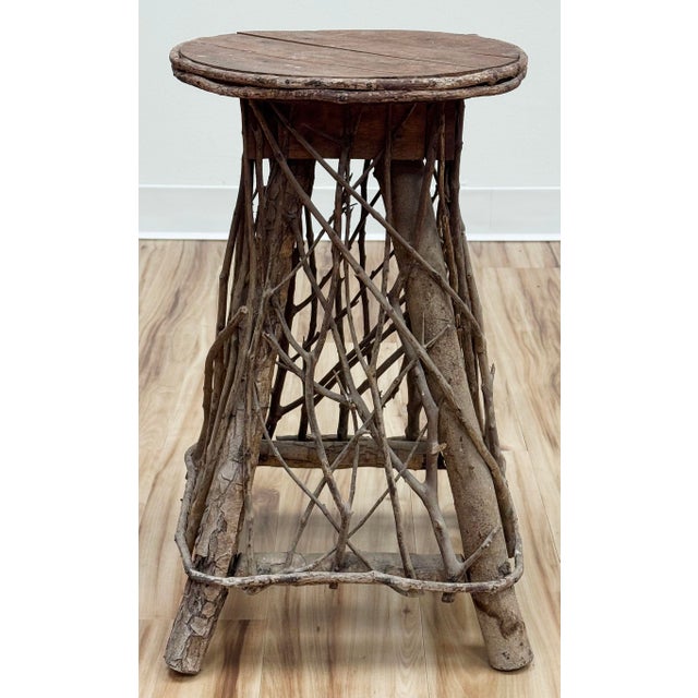 Vintage Adirondack style twig stool or side table, handcrafted from willow branches with wood top. Rustic early 20th...
