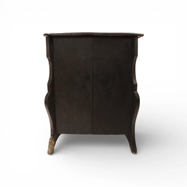 This French Mazarine chest, dating to the 1700s, is distinguished by its bold architectural form and dramatic black...
