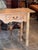 A 19th century pine console with two drawers and a nicely scalloped apron centered by a chip-carved daisy wheel medallion....