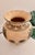 Vintage ceramic vase featuring an intricate wraparound palm tree motif over a richly textured ivory crackle glaze. This...