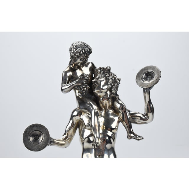 Description - A superb sculpture of solid 800 silver of a satyr being fed grapes by a character sitting on his shoulders....