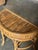 A wonderful small Demi-lune shaped console table. Executed in burnt bamboo with cane wrapping at the joints. This is a...