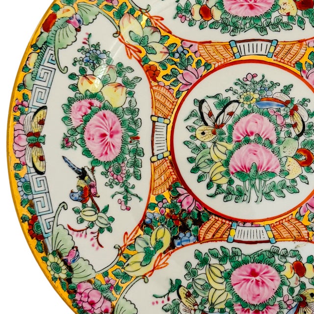 Vintage Chinese Famille Rose Canton decorative plate featuring a lush, intricate composition of hand-painted enamels over...