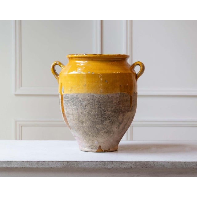 A beautifully aged 19th-century French terracotta jug, this piece reflects the rustic elegance of traditional Provençal...