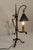 Exceptional antique hand-forged wrought iron table lamp dating to approximately 1925–1945. From a Pennsylvania family...