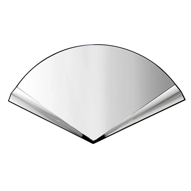 Playful wall mirror in the shape of a handheld fan.