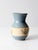 This vintage studio pottery vase by Colorado artist Bob Heinan features a soft blue glaze with a natural center band...