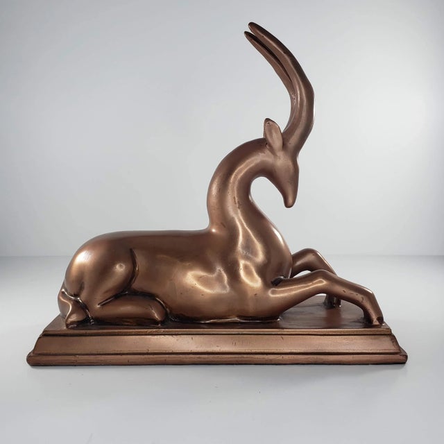 Art Deco Copper Colored Gazelle Impala Deer Statue Figurine It is about 9" tall and about 9.75" wide. It looks like it has...