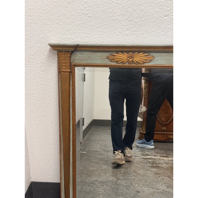 Design Plus Gallery presents a Vintage Neoclassical Style Giltwood Painted Wall Mirror. The rectangular mirror is framed...