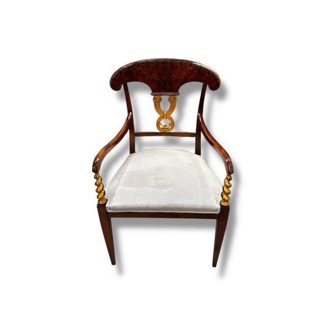This elegant set of two pre-loved accent chairs features rich wood frames with graceful curved arms and beautifully...