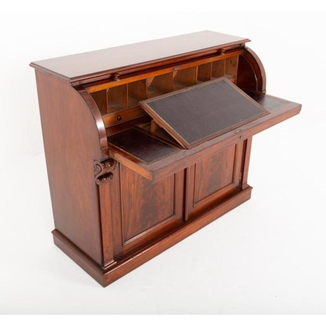 Fine Victorian mahogany cylinder desk of impressive proportions and exceptional character Crafted from richly figured...
