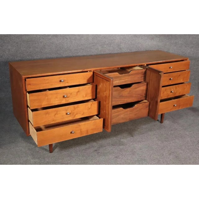 Long Mid-Century Modern dresser by Drexel for their "Declaration" line. Designed by Stewart MacDougal and Kipp Stewart,...