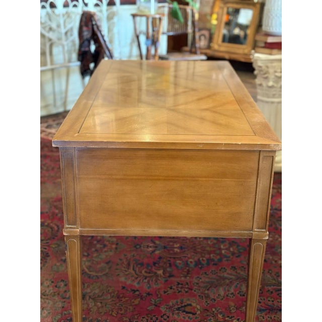 Classically styled, vintage desk with 4 storage drawers, bookmatch veneer on the top, solid wood construction from...