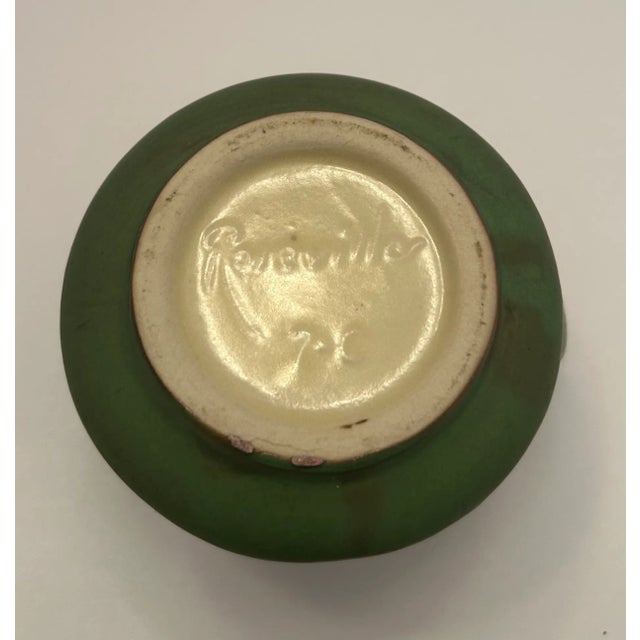 Roseville Pottery creamer in the pattern "Zephyr Lily." Beautiful vibrant dark green with pale yellow Lillies on each...