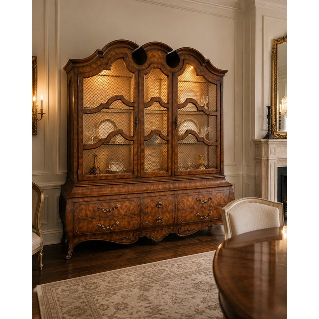 An exceptional and unusually large vintage china cabinet by Mastercraft Furniture Co. of Grand Rapids, Michigan, retaining...