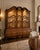 An exceptional and unusually large vintage china cabinet by Mastercraft Furniture Co. of Grand Rapids, Michigan, retaining...