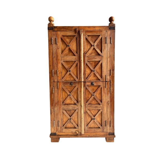 Large, solid wood wardrobe, a unique piece of undocumented origin whose design, construction, and finishes place it around...
