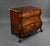 A 19th century Dutch mahogany chest of drawers. The bombe shaped commode chest has a shaped top above three long graduated...