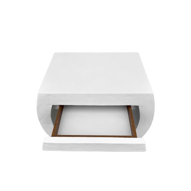 Mid-Century Post Modern side or bedside table in the manner of Karl Springer or John Dickinson, with white plaster finish....