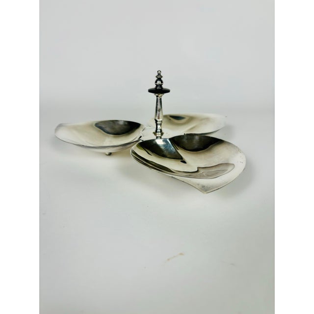 A timeless example of classic American antique silverplate, this elegant three-leaf serving dish by F.B. Rogers Silver Co....