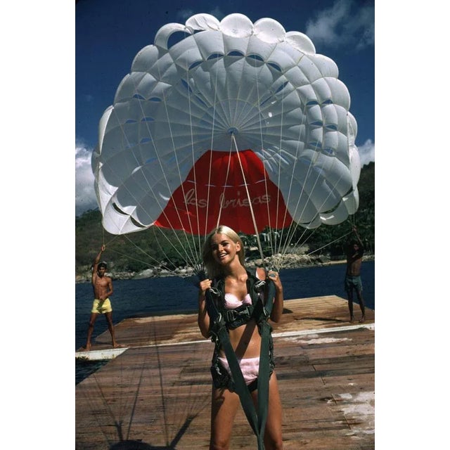 Paraglider 1968 by Slim Aarons Slim Aarons Limited Estate Edition Preparing to go paragliding in Acapulco a young blonde...