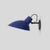 Vv cinquanta wall lamp. Design by vittoriano viganò. This version is with blue lacquered reflector and black mount. The vv...