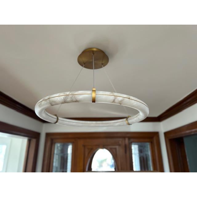 Stunning 31” pendant crafted from natural Spanish alabaster, creating a warm, luminous glow with beautiful organic...