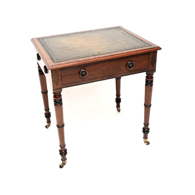 An outstanding antique Georgian Period leather top writing table / desk. It was made in England, it dates from around the...