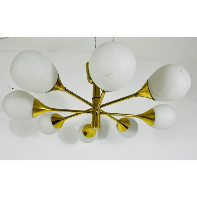 A mid-century chandelier by kaiser leuchten made in germany in the 1960s. It is fascinating with its space age design and...