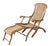 A fine French cruise liner or steamer deck chair (also known as a chaise longue) of patinated teak-wood and woven cane,...