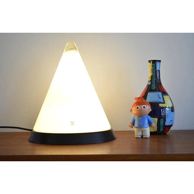 Table lamp of the Peill & Putzler company from the 1970s. The table lamp is completely made of a white - the base plate is...