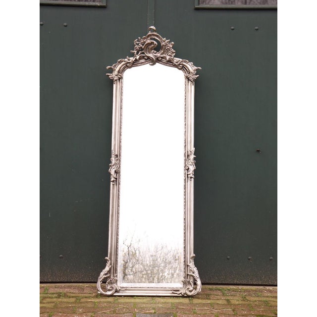 Late 20th Century Rococo Revival Silver Finish Floor Mirrors – Pair Introduce sculptural elegance and luminous presence to...