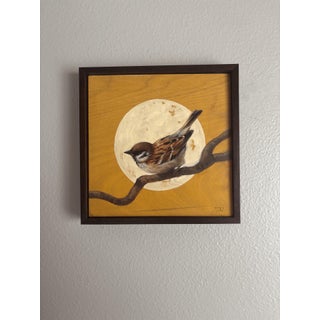 Sparrow by Terra Novak | Oil on wood Painting of a sparrow perched on a branch with a moon background For Sale