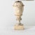A French Empire style carved marble table lamp featuring a visage of Bacchus, the Roman god of wine, to grace the urn of...