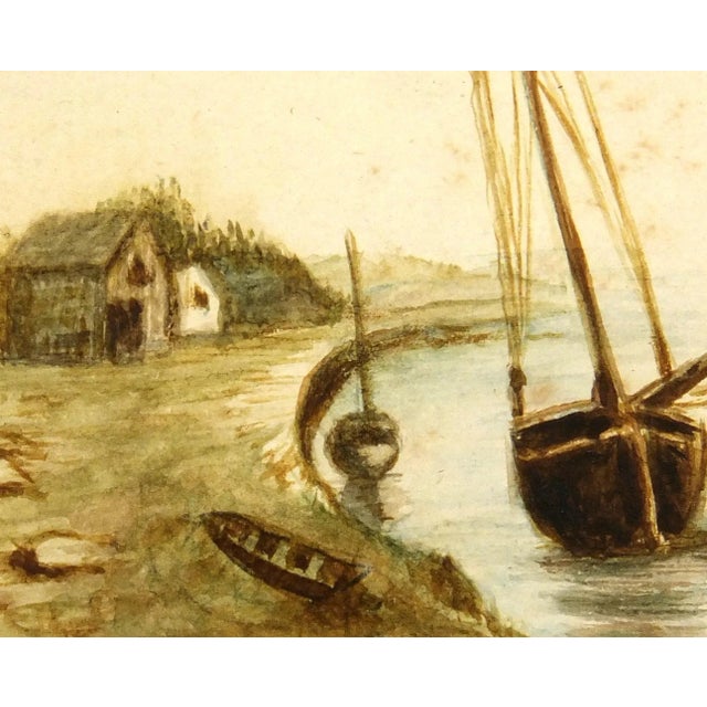 One-of-a-kind watercolor of a peaceful shoreline dwelling and sailing vessel, circa 1900. Displayed on a white mat with a...