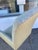 Beautiful Fortuny Fabric upholstered arm dining chair. Fabulous antique Silver Leaf finish. Contrast fabric applied to the...