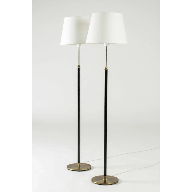 This is a pair of cool floor lamps from Falkenbergs Belysning, made from brass. The sleek square stems are dressed with...