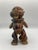 Terracotta figure of a Pygmy spirit believed to once inhabit the grasslands of Cameroon. Charming polychrome detail and...
